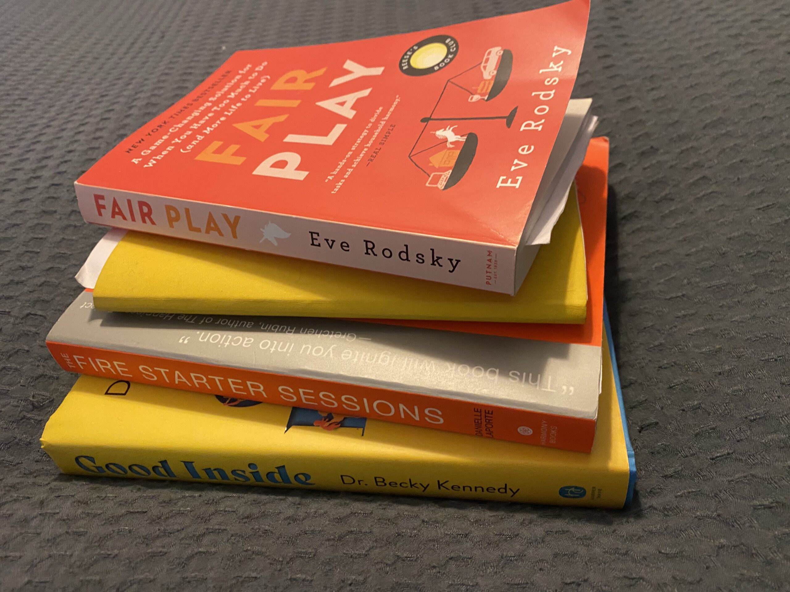 Stack of self-help and parenting books