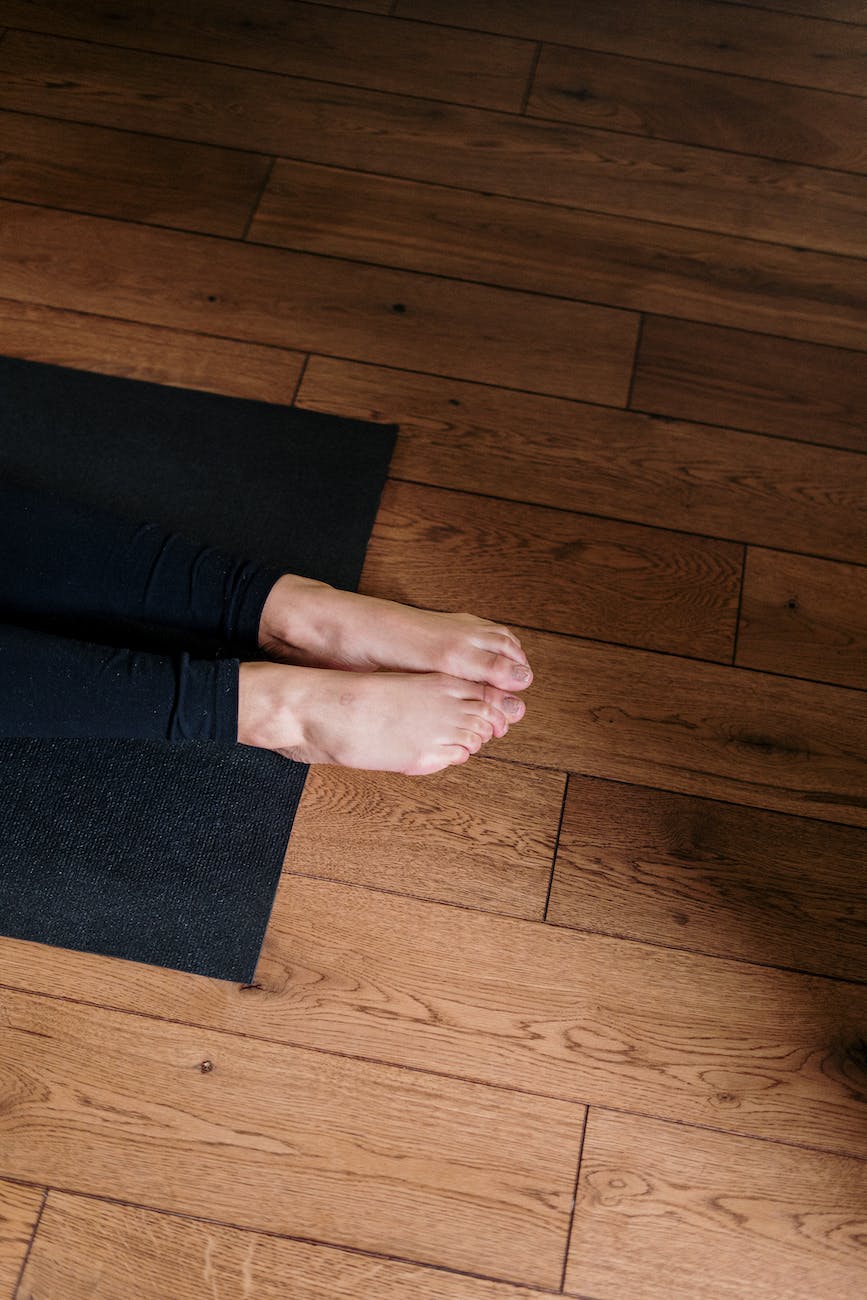 person standing on black area rug